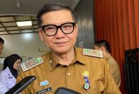 Kepala Dinas Kesehatan Kota Malang, Husnul Muarif, saat diwawancara awak media 2025. (KOMPAS.com/ Putu Ayu Pratama Sugiyo)